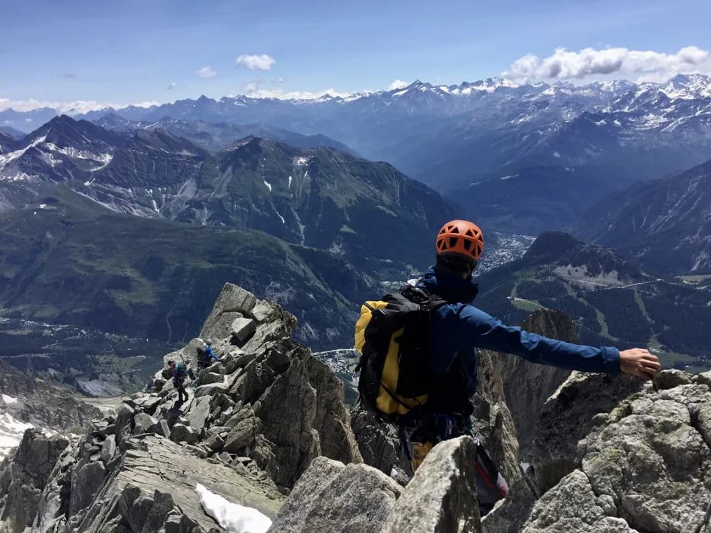 A craggy peak overlooking the Alps, an alpine adventure with breathtaking mountain views.