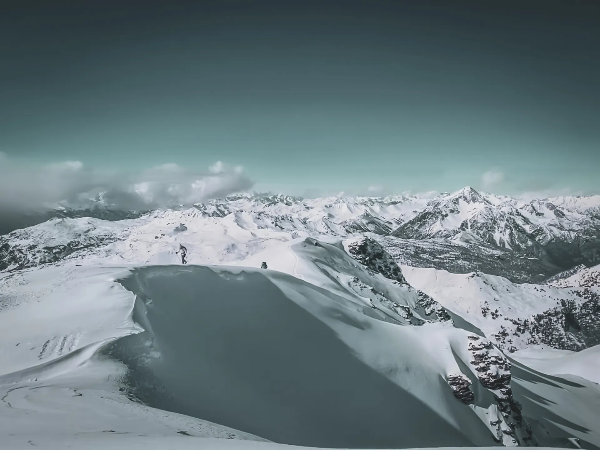 Panoramic views of snow-capped peaks, perfect for a snowshoe trek in the heart of nature.