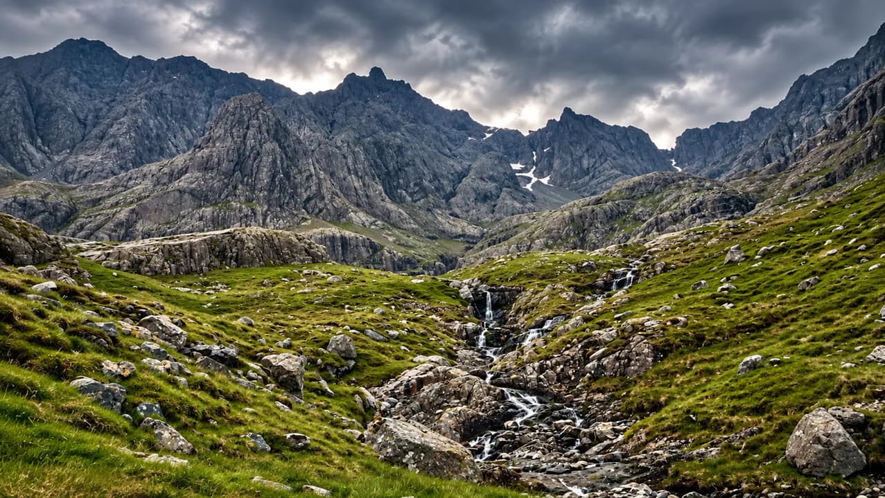 The rugged landscape of the Scottish Highlands, with lush green valleys and majestic mountains set against a dramatic sky.