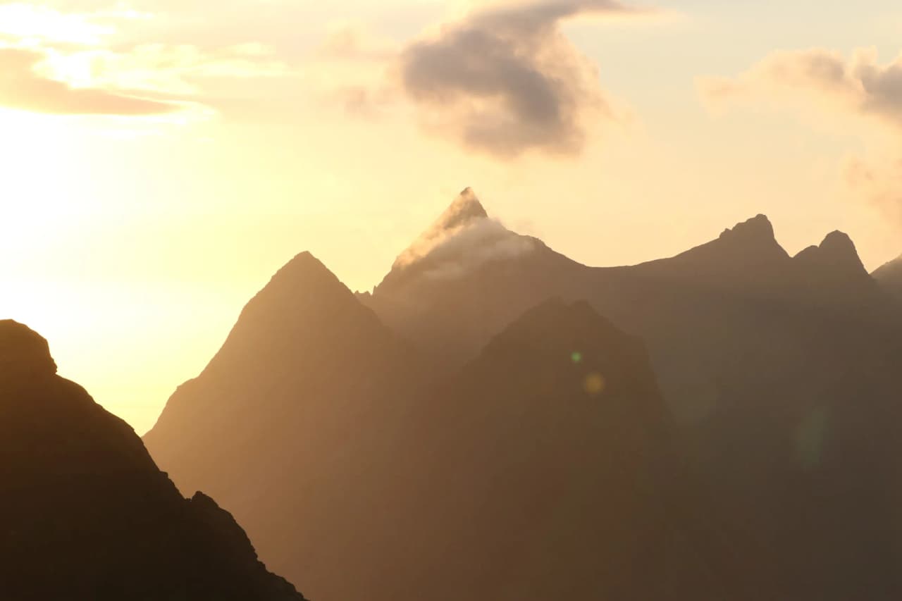 Sunset over the majestic mountains of the Lofoten Islands, a breathtaking spectacle.