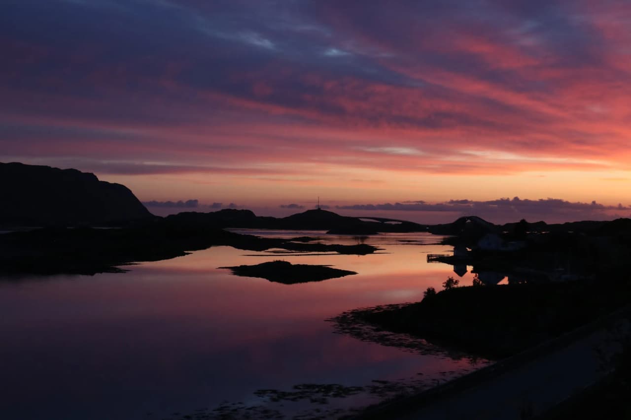 Sunset on the Lofoten Islands, reflection on the calm water, soothing and magical landscapes.