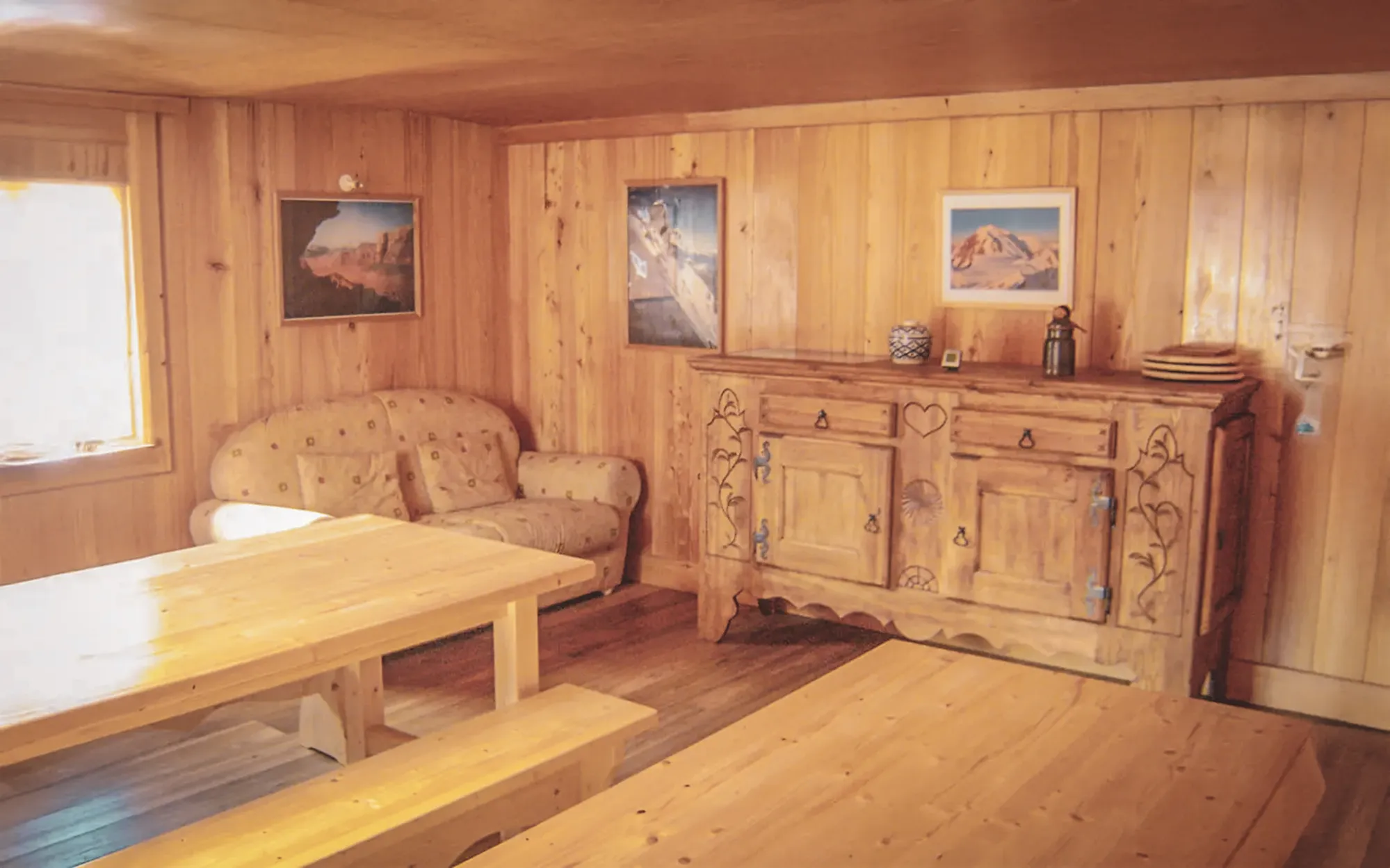 Warm wooden interior with authentic furnishings, perfect for relaxing after mountaineering.
