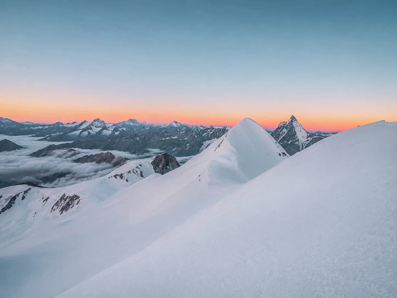 A majestic sunrise over the Breithorn, breathtaking snow-covered landscapes.