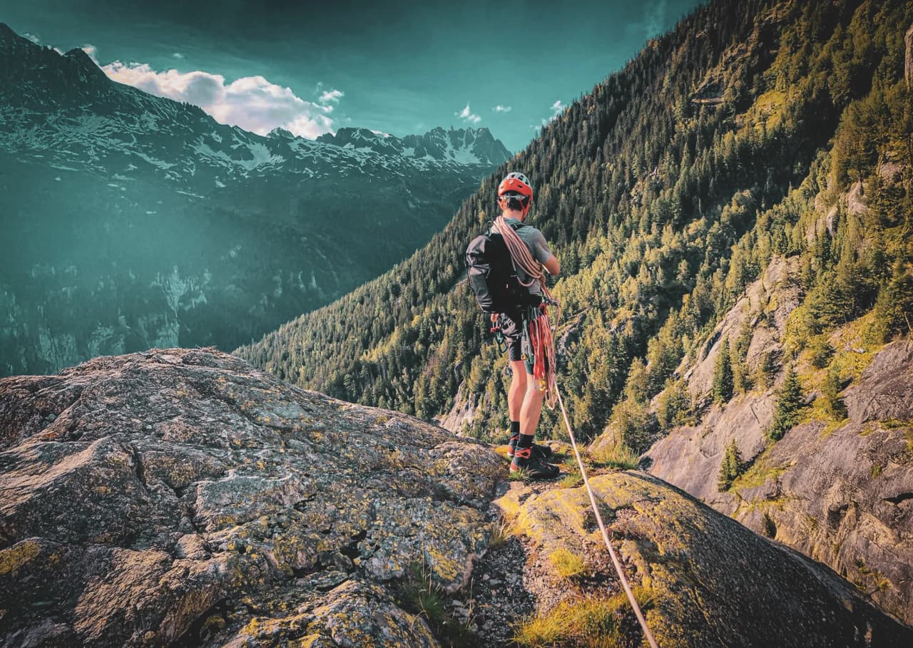 A mountaineer gazing at the majestic mountains of Chamonix, ready for an unforgettable adventure.